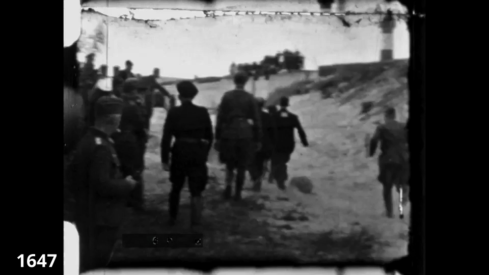 Screenshot from the Wiener Film mass execution in Liepaja 1942 fc 1647 - Jews are being shot close range in a pit